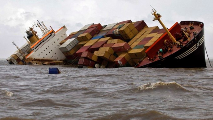 Containers fall from the deck of damaged cargo ship MSC Chitra in the Arabian Sea off the Mumbai coast